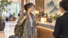 Solo traveler pauses in a staffed city location while checking how to recover a route